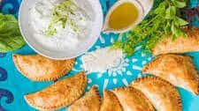 Spinach and feta empanadas with tzatziki