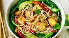 Tofu with stir-fried noodles, pak choi & sugar snap peas