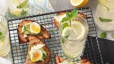 Fizzy lemonade and multigrain bruschetta with avocado topping, quail eggs and Grana Padano Riserva