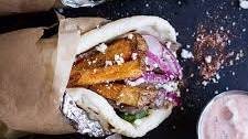 Greek Style Roasted Lamb Gyros with Harissa Spiced Tzatziki.