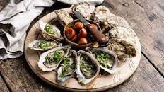 Oysters with Grilled Chorizos and Sherry & Coriander Dressing