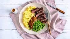 Rump Steak and Cajun Sauce with Mash and Peas