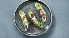 Snack cucumber with Castello® garlic whipped cream cheese