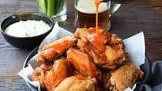 Spicy buffalo wings with blue cheese dip