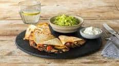 Zucchini and Black Bean Quesadillas with Romaine Salad and Lime Crema