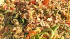 zucchini zoodles drenched in peanut chili and lime sauce