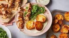 Chicken skewers with lemon-roasted potatoes and whipped feta