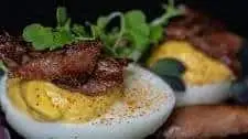 Chipotle and Duck Confit Deviled Eggs with Microgreens