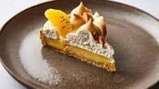 Clementine tart with Italian meringue and caramelised macadamias