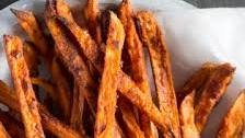 Crispy sweet potato fries with avocado-coriander dip