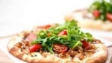 Fontina and Caramelized Onion Flatbread with arugula and grape tomatoes