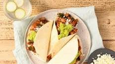 Smoky Chipotle Chicken Tacos with guacamole and queso fresco