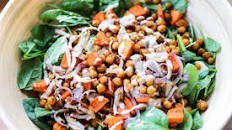 Spinach Salad with roasted chickpea, sweet potato, onion and lemony tahini dressing