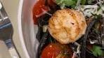 squid ink pasta in a lemon butter sauce with burst cherry ...