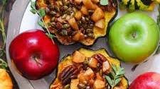 Stuffed Acorn Squash with Maple-Cinnamon Apples, Pecans, and Pumpkin Seeds