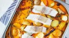 Baked Alaska pollock with root vegetables in red curry and coconut