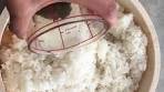 Cooling rice in cedar hangiri 半切 (Sushi Oke) with kombu ...