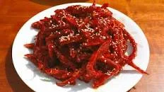 Dried shredded pollock seasoned with gochujang (Bugeopo...