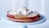 Giant pancake stack with jam and clotted cream