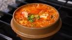 Korean spicy soft tofu stew with seafood (Haemul sundubu ...