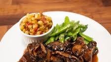 NY Strip Steak with Mushroom Pan Sauce, Crispy Potatoes with Bacon and Snap Peas with Shallots and Mint