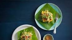 Steamed sea bass wrapped in banana leaves with green mango salad (Luke Nguyen)