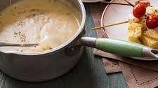 Aged Cheddar Fondue with Grilled Tomatoes, Bacon and Onions