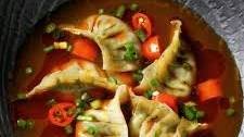 Spinach and mushroom dumplings in a mala broth