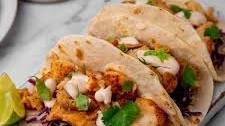 Mouthwatering Fish Tacos with Lime Crema