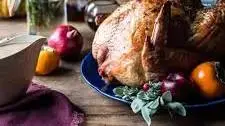 Herb and Butter Roasted Turkey with White Wine Pan Gravy.