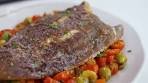 Pan-fried lemon sole with tomato, olive and caper sauce
