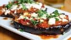 Greek Stuffed Eggplants with onion, tomatoes and topped with ...