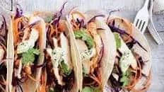 Spicy chicken tacos with slaw and avocado dressing