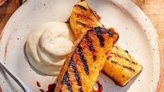 Rum-glazed grilled pineapple with lime crème fraîche