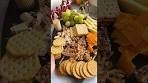 Christmas Party Cheese Board With Fruits Crackers And Nuts ...