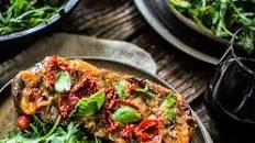 Grilled Steaks with Roasted Tomato-Garlic Butter