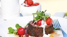 Herb-crusted beef with confit cherry tomatoes
