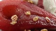 Red Wine Poached Pear Filled with Vanilla Ice Cream and Topped with Granola