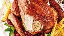 Roast turkey with spiced cranberry-pecan stuffing and maple glaze