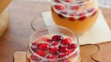 Sparkling ginger apple punch with muddled cranberries