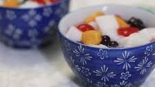 Almond jelly with peaches, cherries and blueberries