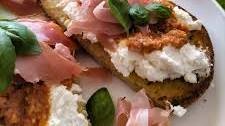 Bruschetta with sundried tomato pesto, ricotta and prosciutto