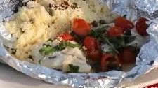 Campfire Fish Grilled In Foil Packets With White Wine And Garlic Sauce