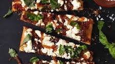 Goat Cheese Pizza with Caramelized Onions, Fig Jam & Basil
