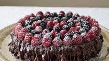 Heaven by Flourless Chocolate Cake topped with ganache and berries