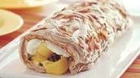 Mango passionfruit pavlova roll