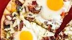 Rise and shine with this grilled breakfast pizza! It's time to pull ...
