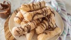 Small fritters with chocolate spreadable cream: the recipe for the delicious fried dessert