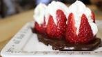 Strawberries Filled with Whipped Cream Over a Bed of ...