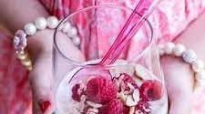 Vanilla Bean Coconut Quinoa Pudding with Honey Drizzled Raspberries.